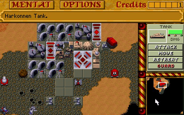 A player base on Arrakis with refineries, concrete paving, and spice harvesters on the surrounding sand.