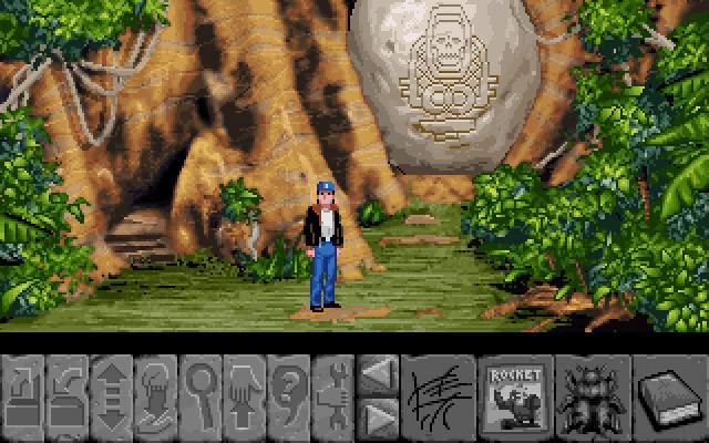 Joe King talking to a character in a jungle setting