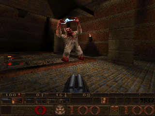 Combat inside a dark stone room in Quake