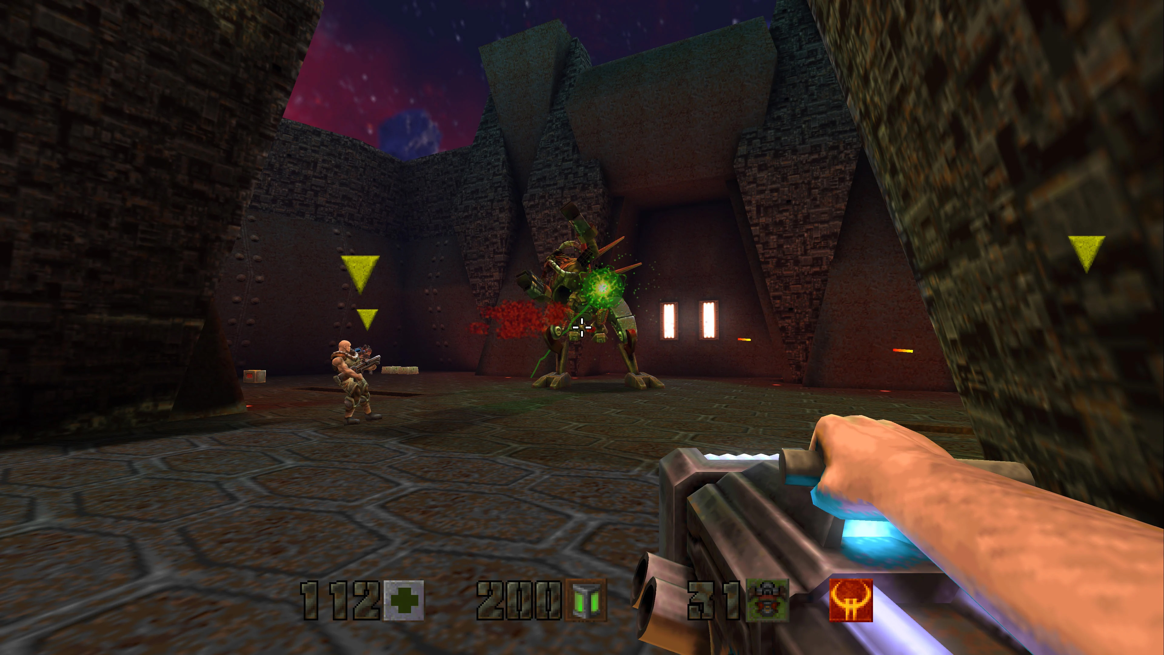 Player firing a weapon inside a metallic Strogg facility